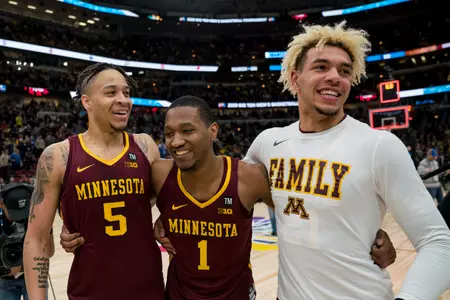 Minnesota Gophers guard Amir Coffey (5), Minnesota Gophers guard Dupree McBrayer (1), Minnesota Gophers forward Jarvis Omersa (21)
