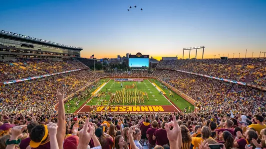 PHOTO #8: Fans celebrate a flyover at TCF Bank Stadium during the season opener against SDSU on August 30.