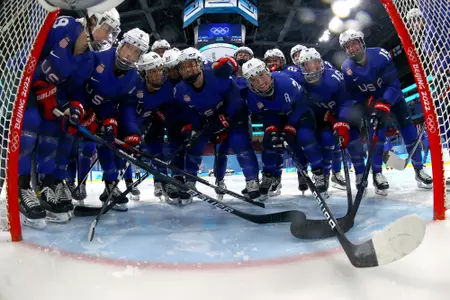 BEIJING, CHINA - FEBRUARY 08: (L-R) Jincy Dunne #19, Megan Keller #5, Amanda Kessel #28, Jesse Compher #18, Abbey Murphy #37, Megan Bozek #9, Hilary Knight #21, Dani Cameranesi #24, Hayley Scamurra #16, Savannah Harmon #15 and their Team United States teammates huddle together at their net before the Group A Women's Preliminary Round ice hockey match between Team United States and Team Canada at Wukesong Sports Centre on February 08, 2022 in Beijing, China. (Photo by Jonathan Ernst - Pool/Getty Images)