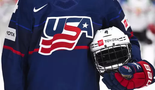 HERNING, DENMARK - SEPTEMBER 1: USAâ??s Caroline Harvey #4 holds her helmet during the national anthem after a 12-1 Quarterfinal Round win against Hungary at the 2022 IIHF Ice Hockey Womenâ??s World Championship at KVIK Hockey Arena on September 1, 2022 in Herning, Denmark. (Photo by Matt Zambonin/HHOF-IIHF Images)