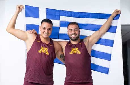 zaltos and mantzouranis with greek flag in 2025 media day