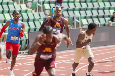 zion campbell handing the baton off to kion benjamin at the 2025 ncaa outdoor track and field championships
