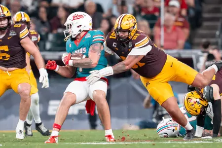 Deven Eastern competes against New Mexico in the Rate Bowl