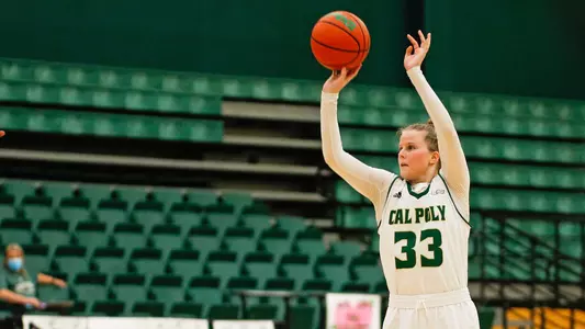 Maddie Willett of Cal Poly shoots against New Mexico State at Mott Athletics Center (Photo by Owen Main ©)