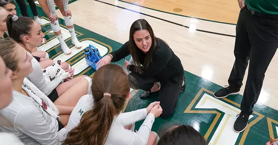 Caroline Walters in the huddle vs. UCSB, 2019