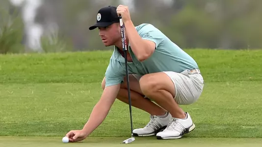 Will Draper lines up a putt.