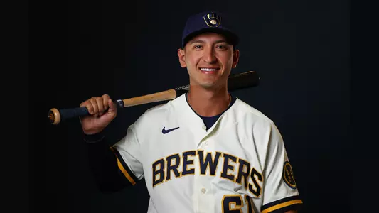 Mark Mathias holding a baseball bat.