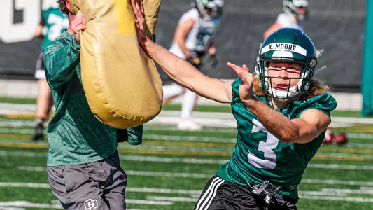 Xavier Moore shifts away from the blocking pad.