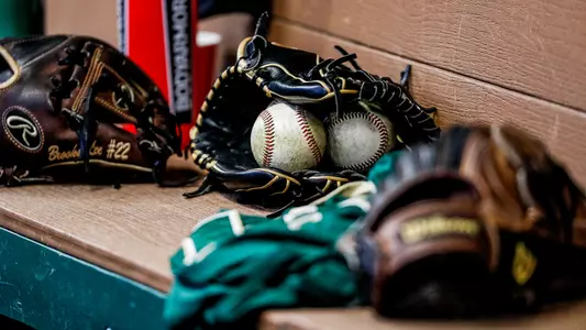 Baseball equipment in the dugout.