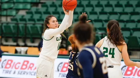 Cal Poly guard Junie Dickson shoots a 3-pointer in Mott Athletics Center in 2021 vs. UC Irvine (Photo by Owen Main ©)