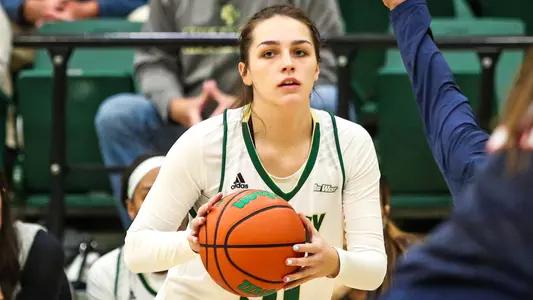 Gianna Silvestri of the Cal Poly women's basketball squad looks to pass (Photo by Owen Main ©)