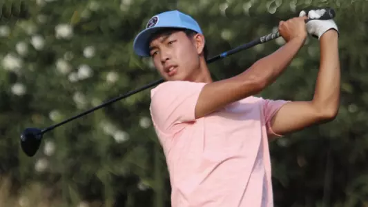 Drew Kim follows his drive.
