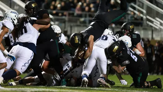 Lepi Lataimua dives oner the line for a touchdown.