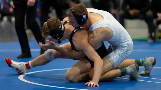 Evan Wick wrestles Shane Griffith of Stanford.
