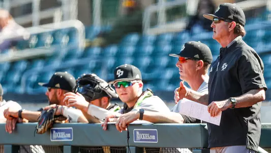 Larry Lee watches from dugout in 2020 season opener.