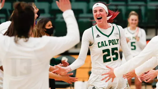 Kirsty Brown of the Cal Poly women's basketball team smiles during Mustang starting lineup intros in 2021 (Photo by Owen Main)