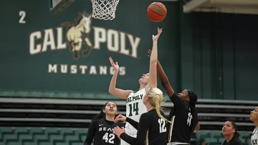 Hannah Scanlan of Cal Poly attempts a layup against Long Beach State (Photo by Owen Main ©)