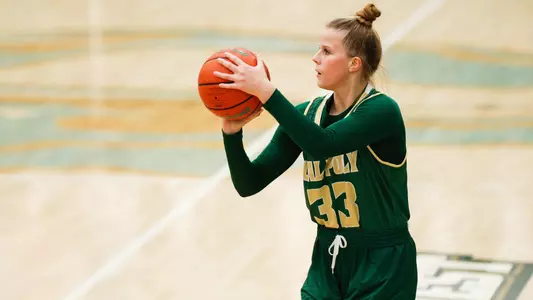 Maddie Willett from Cal Poly lines up a 3-point shot during the 2021 season. (Photo by Owen Main ©)