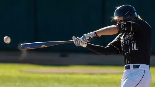 Tate Samuelson connects with a pitch.