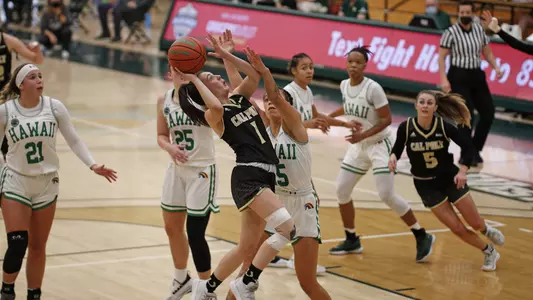 Cal Poly's Abbey Ellis drives against Hawai'i (Photo by Owen Main ©)