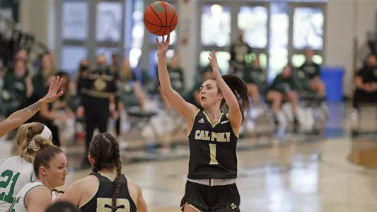 Abbey Ellis attempts a shot for Cal Poly against Hawai'i in 2021 (Photo by Owen Main ©)