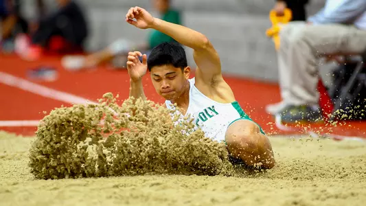 Nathan Bustos from the Cal Poly Track & Field team lands in the long jump pit on March 23, 2019 (Photography 805)
