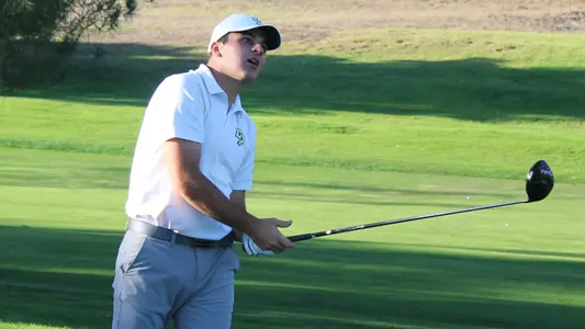 Luke Adam watches his drive.