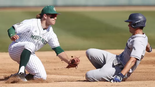 Tate Samuelson tags out a runner at third.