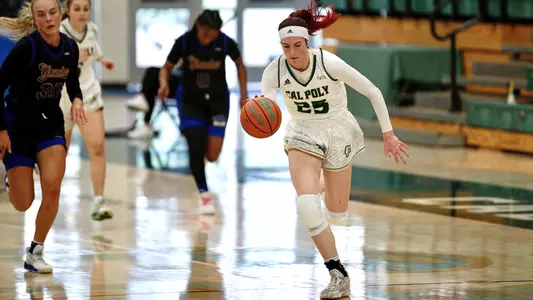 Cal Poly's Kirsty Brown dribbles upcourt on the break vs. UCSB on March 6, 2021 (Photo by Owen Main ©)