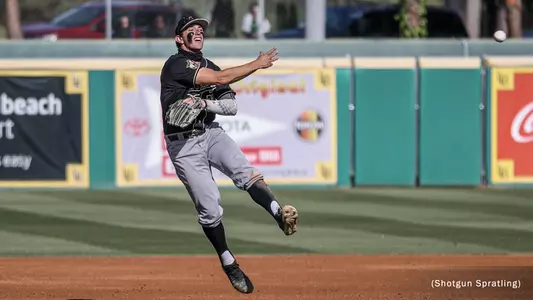 Brooks Lee throws to first base.