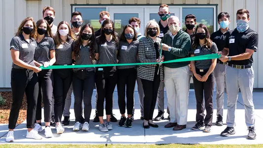Ribbon cutting with the Swansons.