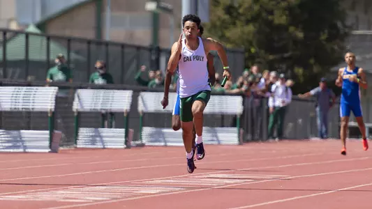 Cal Poly's Hunter Matys anchors the 4x100m relay squad to a win against UCSB at home on May 1, 2021. (Photo by James Colon)