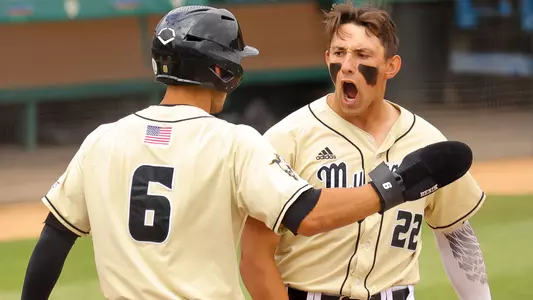 Brooks Lee greeted at home plate after hitting a grand slam.