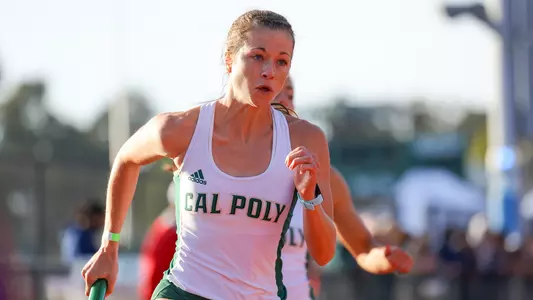 Cal Poly's Cassidy Hubert takes the baton against UCSB and Fresno State on April 3, 2021. (Photo by Kyle Calzia)