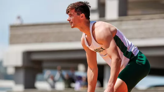 Cal Poly's John Walther reacts after clearing the high jump bar on April 3, 2021. (Photo by Owen Main)