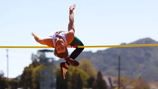 Kevin Schmitt of Cal Poly takes to the air in the high jump on May 1, 2021.