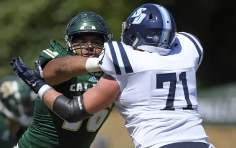 Cal Poly defensive lineman Myles Cecil battles a USD blocker in 2019. (Photo by Matt Brown)