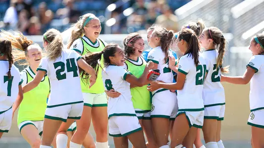Cal Poly players celebrate a game-winning goal at home on Sept. 29, 2019. (Photo by Owen Main)