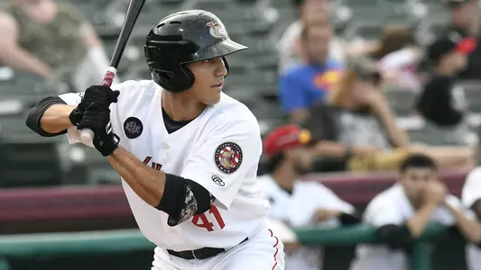 Alex McKenna bats in minor league game.