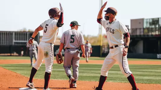 Ben Greenspan high-fives an Arizona State player.