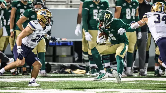 Chris Coleman runs for extra yardage.