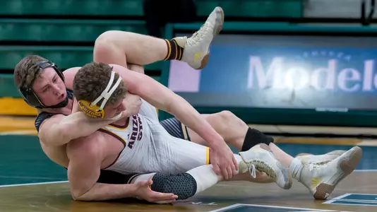 Bernie Truax tries to pin his Arizona State opponent.