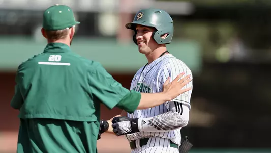 Brooks Lee chats with assistant coach Justin Bridgman.