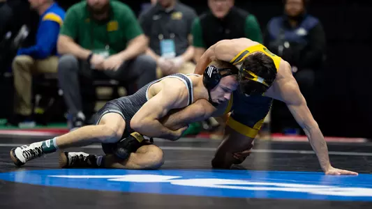 Evan Wick wrestles in second round of NCAAs.