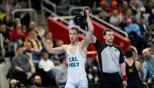 Evan Wick has hands raised after win.