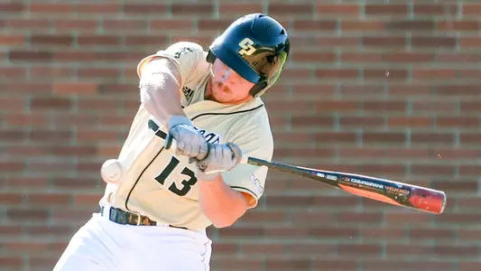 Mark Armstrong swings at a pitch.