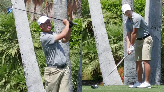 Nicholas Mok and Baron Szeto tee off.
