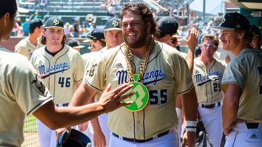 Joe Yorke celebrates home run in dugout.