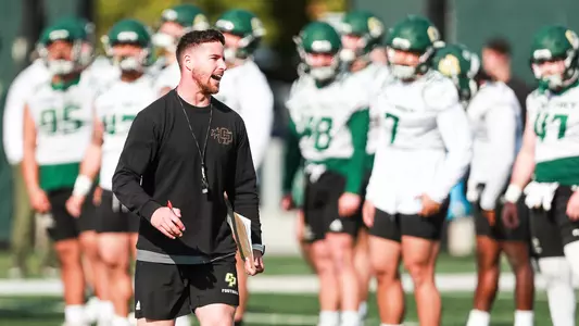 Henry Adelman conducts warm-up drills.