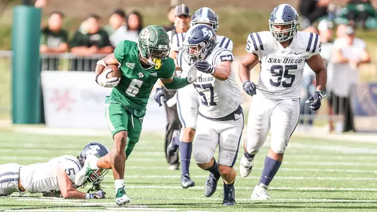 Chris Coleman tries to break free from several Toreros.